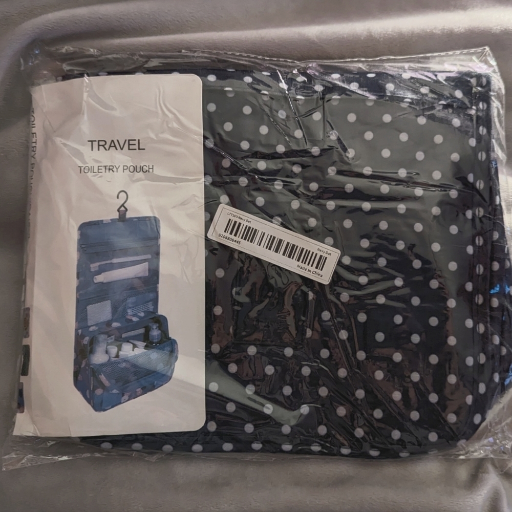 Toiletry bag BNWT, navy & white polka dot colour, lots of pockets